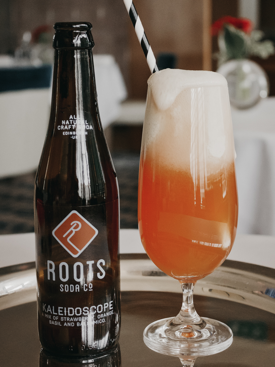 Roots Soda Co. float with straw.